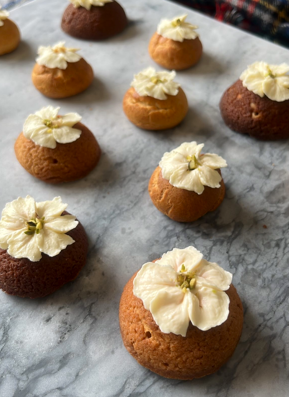 Images in rotation: Choux pastry with flower-shape cream piping on top, flower-shaped cream tart and tart with ring-shaped choco on top